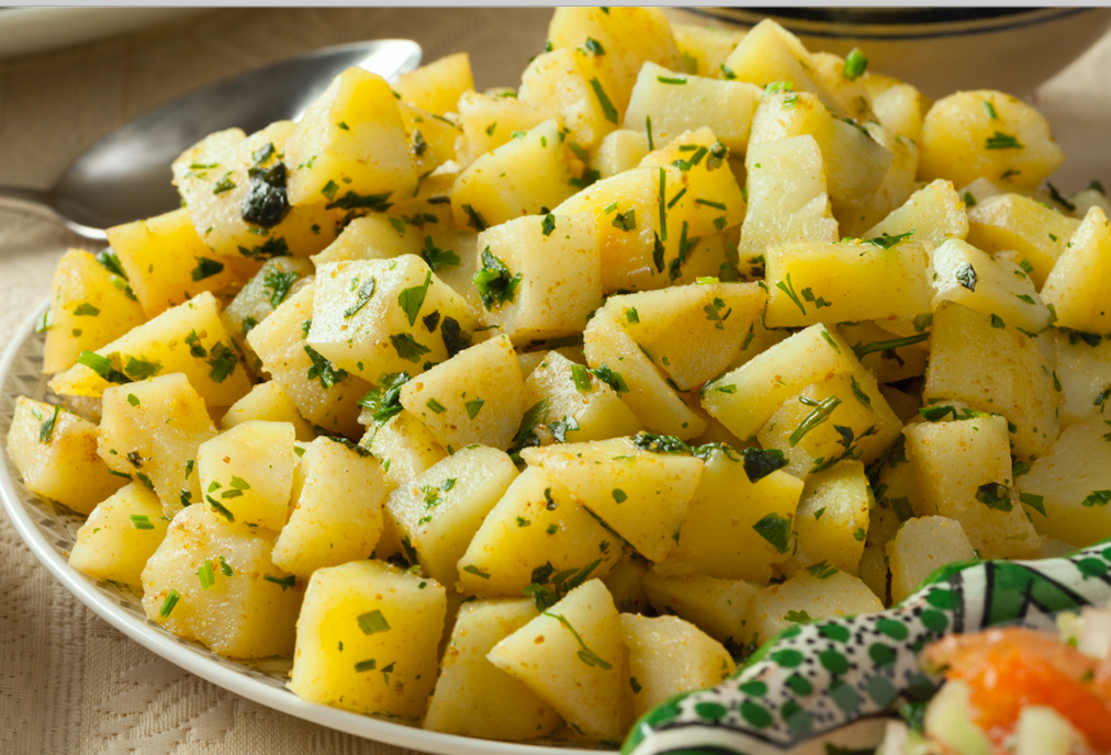 Potato salad adorned with Mediterranean sizzle
