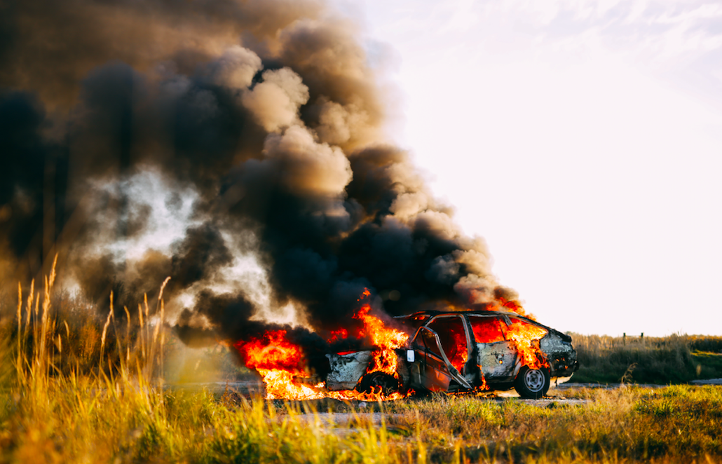 A new luxury car, built by Tesla, was in flames with the driver stuck inside